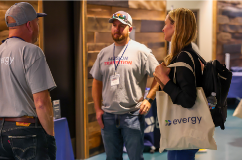 Evergy employees talking at Mission Transition event