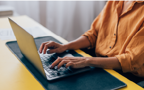 person typing on computer
