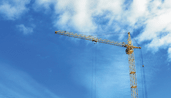 A photo of a crane in the sky