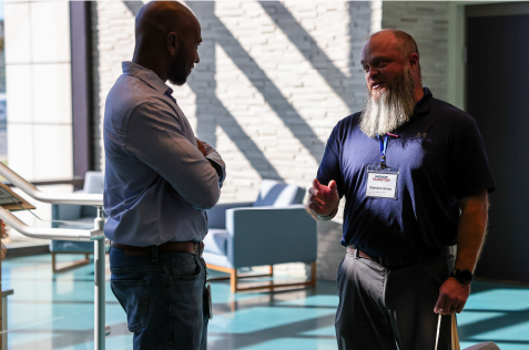 Two Mission Transition attendees talking