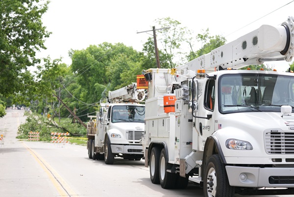 Evergy trucks lined up to respond to severe storm damage