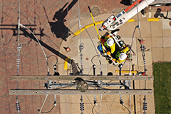 Photo of an Evergy worker in a bucket truck from above