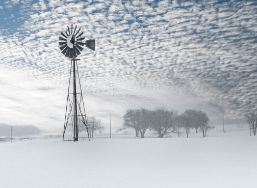 windmill in a snowy field